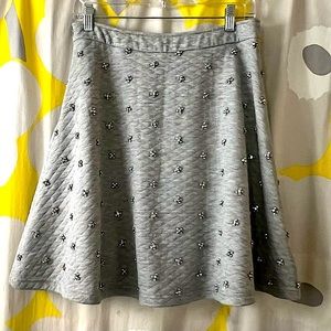 Rhinestone, “quilted” jersey, A-line mini skirt from London.